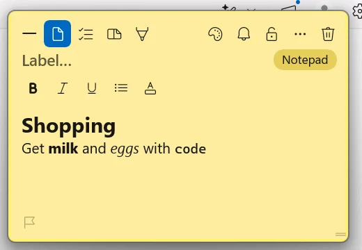 A yellow TackNote note stuck to Notepad, its binding pill reading Notepad, showing a heading and bold and italic text